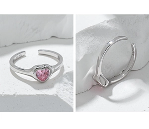 Detail shot of the S925 hallmark on silver ring with pink heart-shaped zircon stone