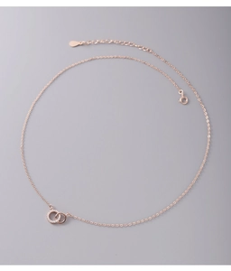 Detailed close-up of rose gold S925 silver interlocking double ring necklace with cubic zirconia