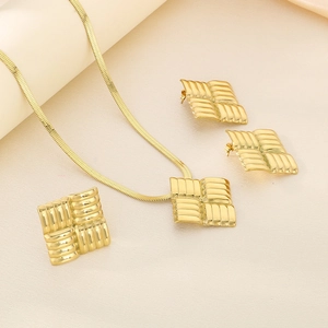 Detail of 18K gold stainless steel jewelry set with square woven texture and flat snake chain