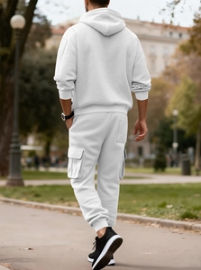 Outdoor shot of men's white fleece hoodie and cargo joggers set showing the back view