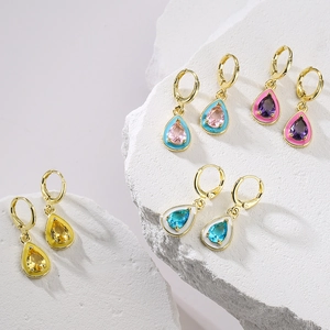 Bohemian gold plated teardrop earrings with colorful stones on white stone base
