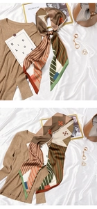 Detail of vintage French silk scarf featuring houndstooth and geometric stripe patterns