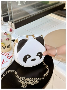 Close-up of a panda-shaped children's crossbody bag with gold chain and dual zippers