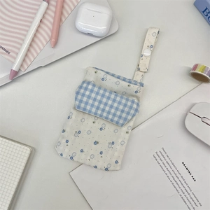 Detailed view of floral nurse pocket organizer on a desk with stationery and office items