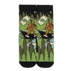 Detail of high-quality cotton socks featuring a forest and Bigfoot print in green and black