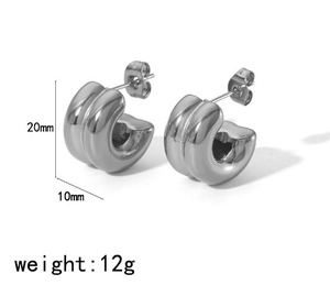 Detail view of chunky C-shaped stainless steel earrings with 20mm height and 10mm width