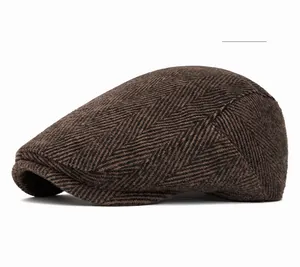 Detail of coffee brown herringbone texture on retro winter flat cap with thick fabric
