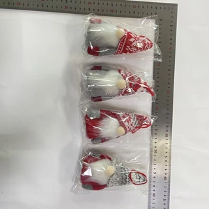 Detailed size measurement of four light-up knitted Christmas gnomes with ruler reference