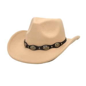 Close-up of beige western cowboy hat featuring black band with silver sunburst metal studs