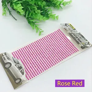 Macro detail of self-adhesive 3mm rose red acrylic rhinestones for DIY decoration