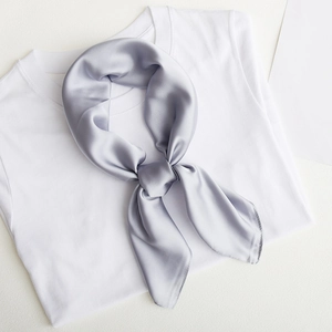 Silver grey satin square silk scarf knotted on a white T-shirt for minimalist styling