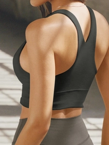 Rear view of black high-stretch sports vest with racerback design and seamless finish
