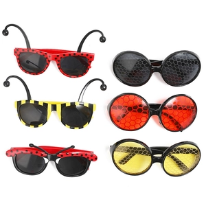 Set of six colorful bee and ladybug party glasses with striped frames and antenna details