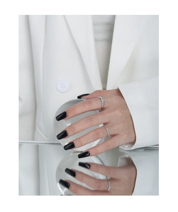 Close-up of elegant S925 sterling silver rings with zircons on a model's hand