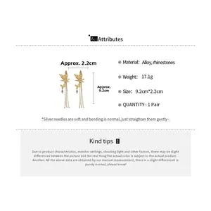 Detailed view of golden butterfly tassel earrings with sparkling rhinestones and long fringe
