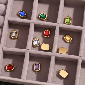Macro shot of rectangular colorful gemstones in a gray velvet jewelry organizer