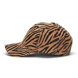 Detail shot of the zebra print texture on a casual baseball cap with curved brim