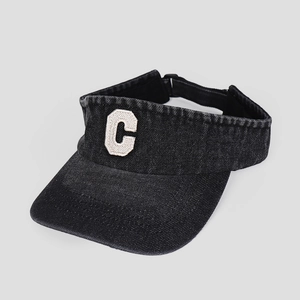 Detail of grey denim sun visor with white C letter embroidery and adjustable back strap