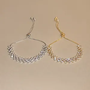 Adjustable geometric zircon bracelet set in gold and silver finish with slide clasp