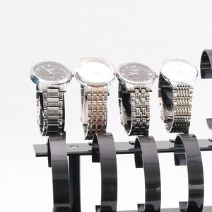 Three-tier black acrylic watch display stand with 24 slots for jewelry and bracelets