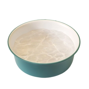 Minimalist green and white washbasin with a sleek contrasting two-tone color design