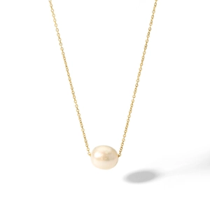 Detail view of a natural baroque freshwater pearl on a minimalist gold stainless steel chain