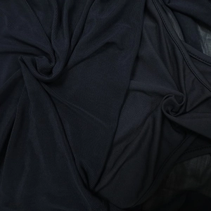 Macro detail of black sheer mesh fabric with fine knit texture and neat edge stitching