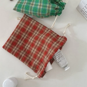 Detailed view of plaid cotton linen drawstring pouches for organizing small items