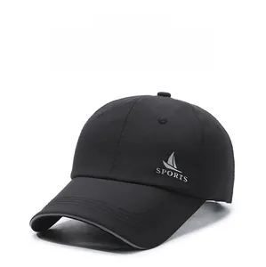 Detail view of quick-dry black baseball cap with SPORTS logo and reinforced brim stitching