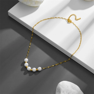 Elegant gold titanium steel necklace featuring five white pearls on a minimalist chain