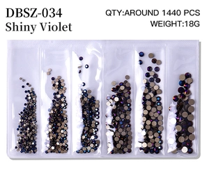 Detail of Shiny Violet flatback nail art rhinestones in a six-compartment plastic box
