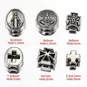 Antique silver religious beads with cross and saint motifs for DIY jewelry making