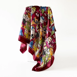 Detailed view of 90cm satin silk scarf with colorful artistic cat prints and burgundy borders