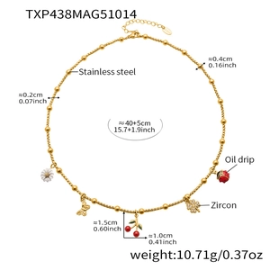 Detail of stainless steel necklace with daisy, butterfly, cherry, and zircon charms