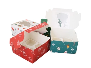 Detail of Christmas cupcake boxes with window display, festive patterns, and inserts