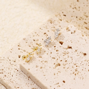 Macro detail of S925 silver water drop stud earrings with sparkling cubic zirconia