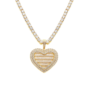 Iced out gold plated heart pendant necklace set with sparkling crystals in hip hop style