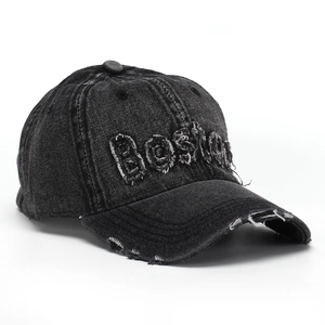 Detailed view of vintage washed denim cap with 3D BOSTON embroidery and distressed brim