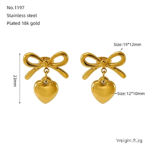 Detail of 18k gold plated bow and heart earrings with precise size and weight info