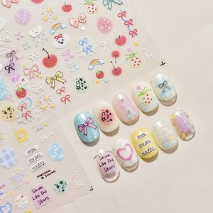 Kawaii 3D embossed nail art stickers with cute dog, bow, and cherry designs in macaron colors