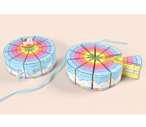 Macro view of rainbow cake-shaped triangular gift boxes with Best Wishes stickers