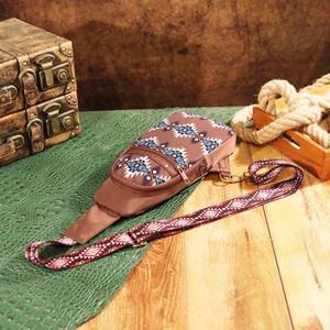 Detailed view of Aztec bohemian crossbody bag with geometric patterns and adjustable strap
