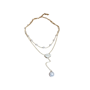 Double-layer gold necklace with sweet camellia pendant and white pearl accents for women