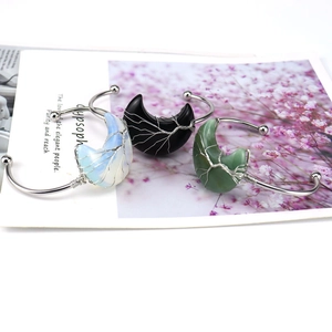 Detailed wire-wrapped tree of life design on crescent moon natural stone bangles