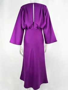 Detail of purple satin long sleeve dress showing flared bell sleeves and glossy silk texture