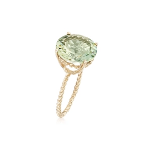 Detail of vintage gold-plated twist ring with a large oval-cut pale green gemstone