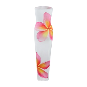 Detail of tropical plumeria print on white strapless bodycon long summer vacation dress