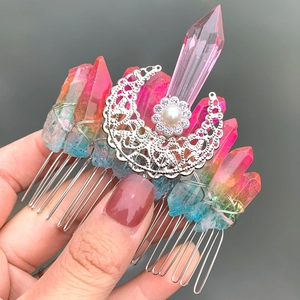 Detail of handmade quartz crystal hair comb with crescent moon pendant and pearl