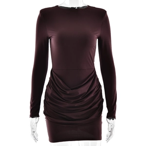 Detail of the ruching and gathered texture on a dark brown long-sleeved bodycon dress