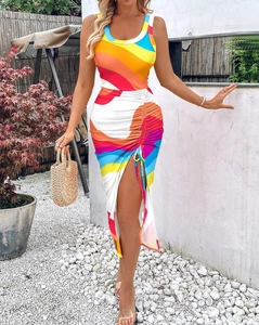 Detail view of the colorful abstract print with drawstring ruched side and high slit edge